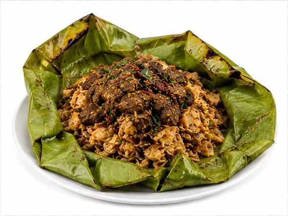 Kizhi Porotta Beef flaky soaked steamed banana leaf bundle