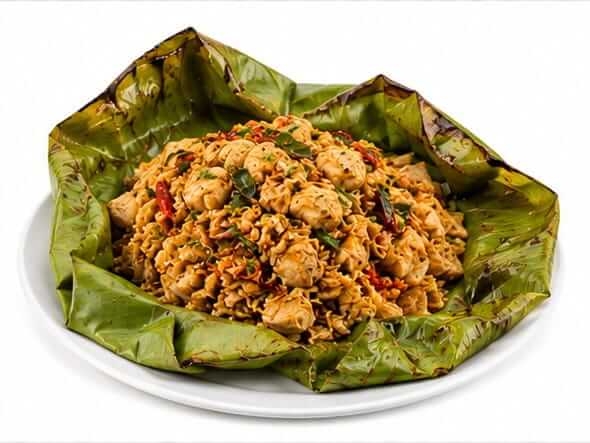 Kizhi Porotta Chicken tied banana leaf steam roasted gravy